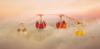 Ferris Wheel in Amusement Park Emerging from the Clouds